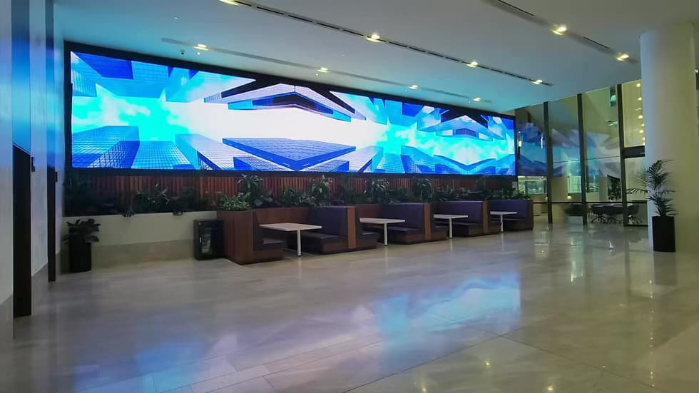 Large indoor LED wall behind a stage in an auditorium